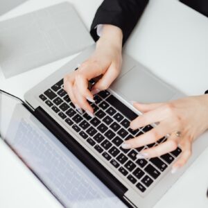 Person Using Black and Silver Laptop Computer