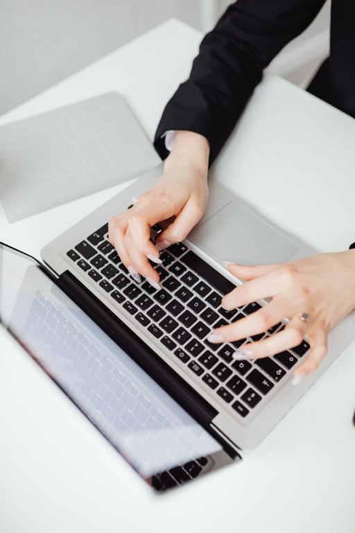 Person Using Black and Silver Laptop Computer